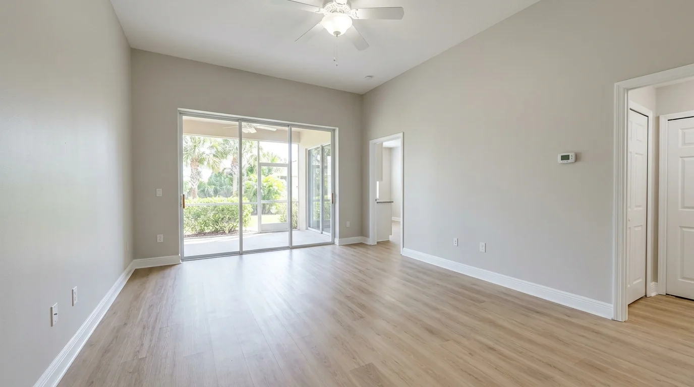 Freshly painted empty rental living room with neutral walls and white trim ready for new tenants in Sarasota